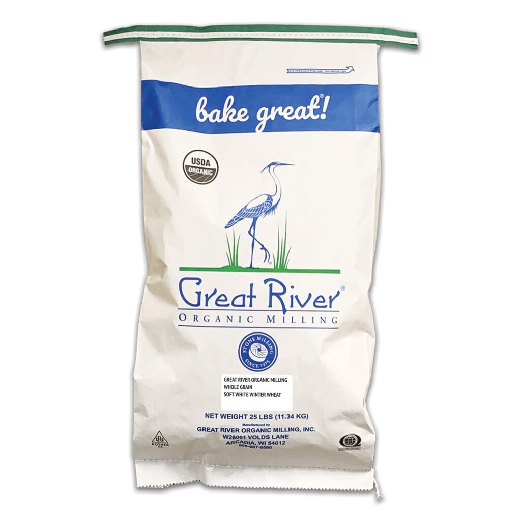 A line drawing  of a blue heron adorns a 25 pound bag of wheat berries from Great River Organic Milling.